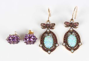 A pair of gold, opal, synthetic opal and treated ruby pendant earrings, each with an oval drop