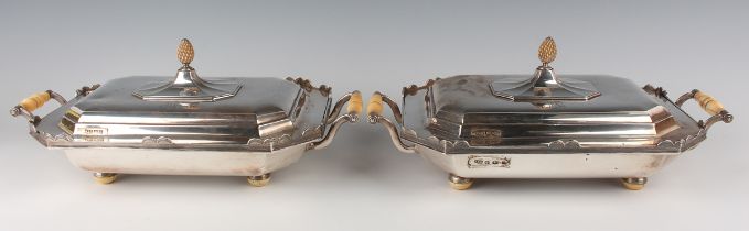 A pair of George V silver entrées dishes, covers and liners, each of canted corner rectangular