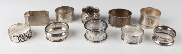 An Edwardian silver napkin ring with engraved foliate decoration, Birmingham 1903, and a group of
