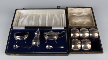An Elizabeth II silver three-piece condiment set, comprising mustard, salt and pepper caster, London