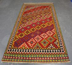 A Ghashghai kelhim rug, South-west Persia, mid-20th century, the red field with overall offset