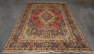 A Tabriz carpet, Central Persia, mid-20th century, the pink field with a shaped medallion, within