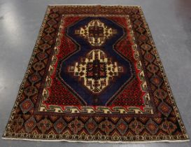 An Afshar rug, South-west Persia, late 20th century, the deep blue field with two bold medallions,