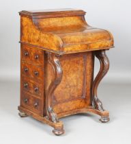 A mid-Victorian burr walnut piano-top Davenport, the pop-up stationery compartment above a curved