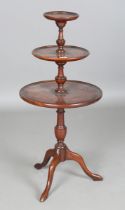 A 20th century mahogany three-tier graduated dumb waiter, on tripod legs, height 97cm, diameter