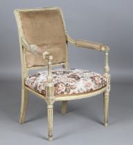 An early 20th century French Louis XVI style painted showframe fauteuil armchair, height 85cm, width