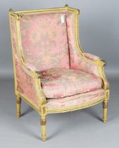 A late 19th/early 20th century French Louis XVI style painted showframe armchair, height 104cm,