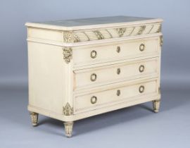 An early 20th century French cream and gilt painted four-drawer commode by Hugnet of Paris, the