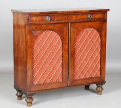 A Regency mahogany side cabinet, fitted with a single drawer above two doors with inset arched