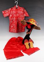 A mid-20th century Chinese red silk child's outfit, comprising jacket, trousers, slippers, gilt