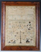 An early George III needlework sampler by Mary Saunders, dated 1763, finely worked in coloured silks