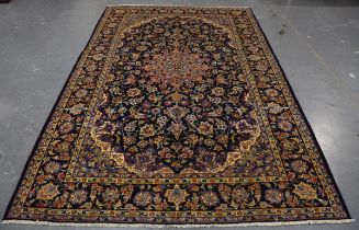 A Najafabad carpet, Central Persia, late 20th century, the dark blue field with foliate medallion,