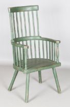 A late 19th century green painted provincial stick back Windsor armchair, height 105cm, width 56cm.