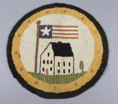 A mid-20th century American circular folk art rug, worked with a large building and American flag,
