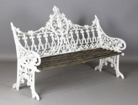 A 20th century Coalbrookdale style white painted cast alloy garden bench with pierced foliate