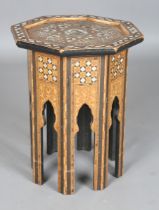 A late 19th/early 20th century Middle Eastern mother-of-pearl inlaid octagonal occasional table, the