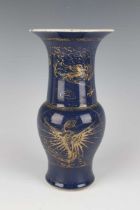 A Chinese gilt decorated blue glazed porcelain 'phoenix tail' vase, Qing dynasty, the baluster