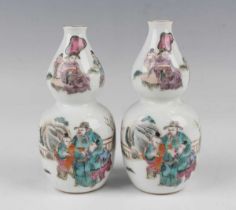 A pair of Chinese famille rose double gourd shaped porcelain vases, mark of Tongzhi but possibly