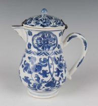 A Chinese blue and white export porcelain jug, Kangxi period, with matched metal mounted cover,