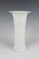 A Chinese blanc-de-Chine porcelain gu beaker vase, probably early 18th century, of flared