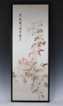 A Chinese silk embroidered rectangular panel, mid-20th century, worked in coloured thread with peony