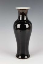 A Chinese mirror black glazed porcelain vase, mark of Kangxi and probably early 18th century, of