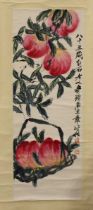 After Qi Baishi - a Chinese hanging scroll depicting fruiting peach branches, 96cm x 35cm, with silk