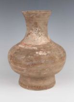 A Chinese pottery hu jar, Han dynasty (206BC-220AD), the low-bellied body and flared neck with
