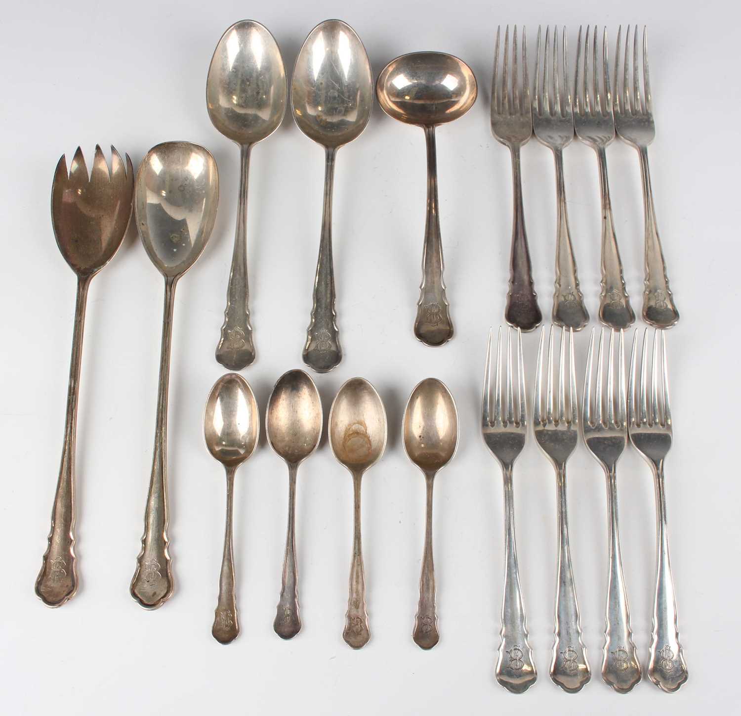 An early 20th century part canteen of silver cutlery, comprising two tablespoons, four table