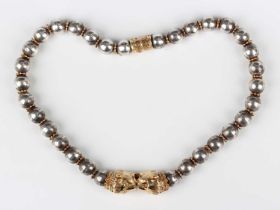 A Zolotas silver and gold beaded collar necklace, the front designed as a pair of lions' heads,
