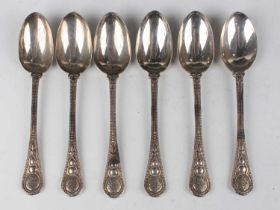 A set of six Victorian silver teaspoons with beaded and floral decoration and fleur-de-lis bowl