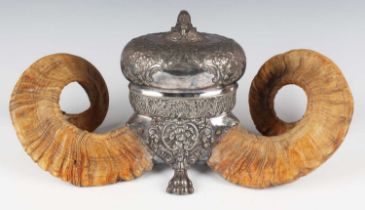 A late 19th century Scottish plated and ram's horn table snuff mull of oval form, the hinged lid