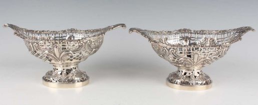 A pair of George V silver baskets, each of oval form with fleur-de-lis style embossed and pierced