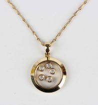 An 18ct gold and diamond circular pendant, glazed with five floating circular cut diamonds, length