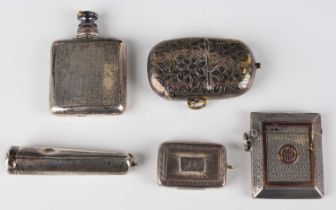 A George III silver rectangular vinaigrette with engraved radiating and circular motif decoration,