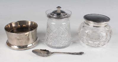 A George VI silver lidded cut glass preserve jar, Birmingham 1941, height 12cm, and a silver