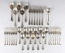 An Edwardian part canteen of silver Old English pattern cutlery, crest engraved, comprising five