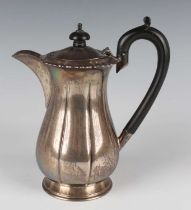 A George V silver coffee pot of lobed baluster form, on a circular foot, London 1929 by Charles