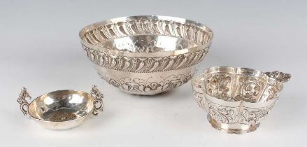 An early 20th century Dutch silver bowl of lobed circular form, embossed with fruit-filled baskets