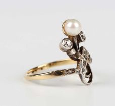 A gold, diamond and cultured pearl ring designed as a stylised foliate spray, mounted with a