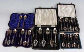 A group of silver cutlery, including a set of six teaspoons and a pair of matching sugar tongs,