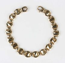 An 18ct gold bracelet of shaped oval panel form, on a sprung hook shaped clasp, import mark