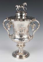 An early Victorian silver equestrian trophy cup and cover of urn form, the domed cover surmounted by