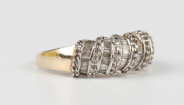 A 9ct gold and diamond ring, mounted with rows of circular cut diamonds alternating with rows of