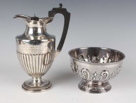 A late Victorian silver half-reeded baluster hot water pot, inscription engraved, Birmingham 1895 by