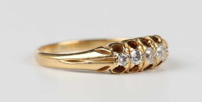A gold and diamond five stone ring, mounted with a row of graduated variously cut diamonds, detailed