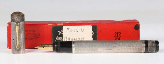 A rare T.B. Ford silver overlaid 'Magnum' fountain pen, the nib detailed 'Ford 428 Mill 14 Carat',