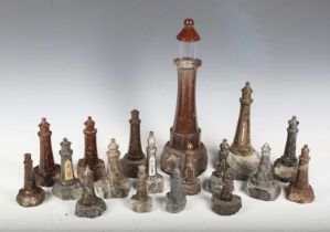 A collection of eighteen early 20th century Cornish turned serpentine model lighthouses, including