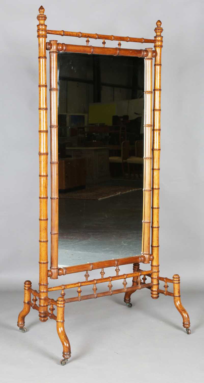 A late 19th century French pitch pine faux bamboo cheval mirror, height 182cm, width 86cm.