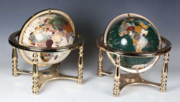 Two late 20th century table globes, diameter 22cm, each with celluloid surface covering hardstone